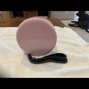 Pink plastic round wristlet